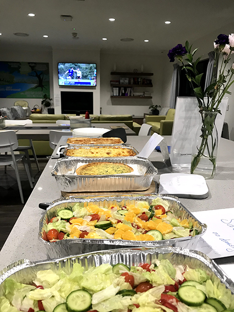 A variety of foods laid out for one of our Dinner Program nights